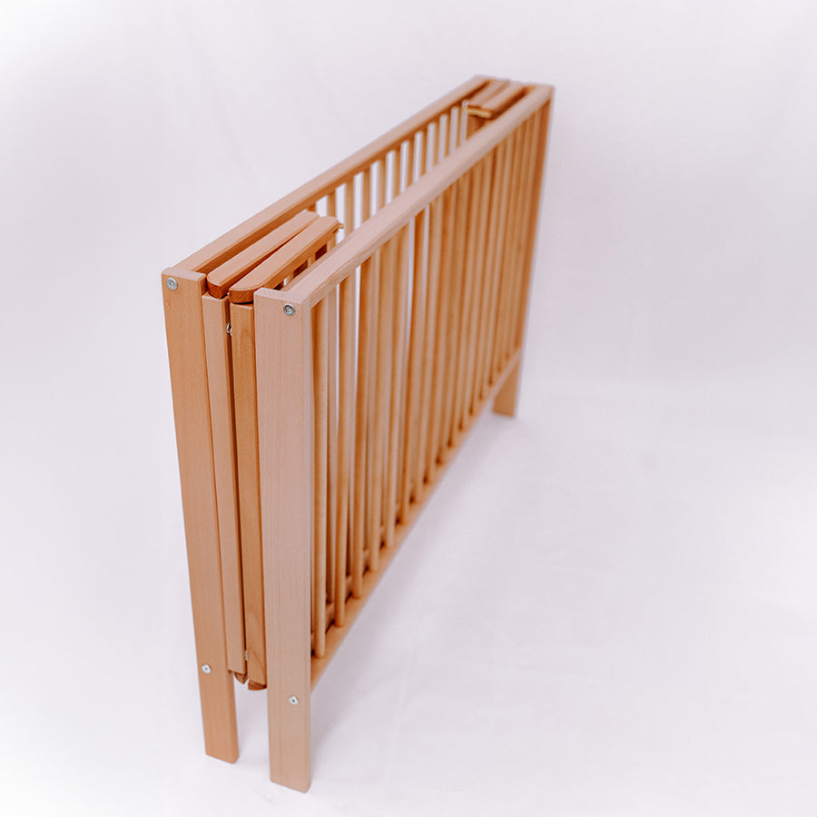 Folding Wooden Cot Natural (Wheels Included)